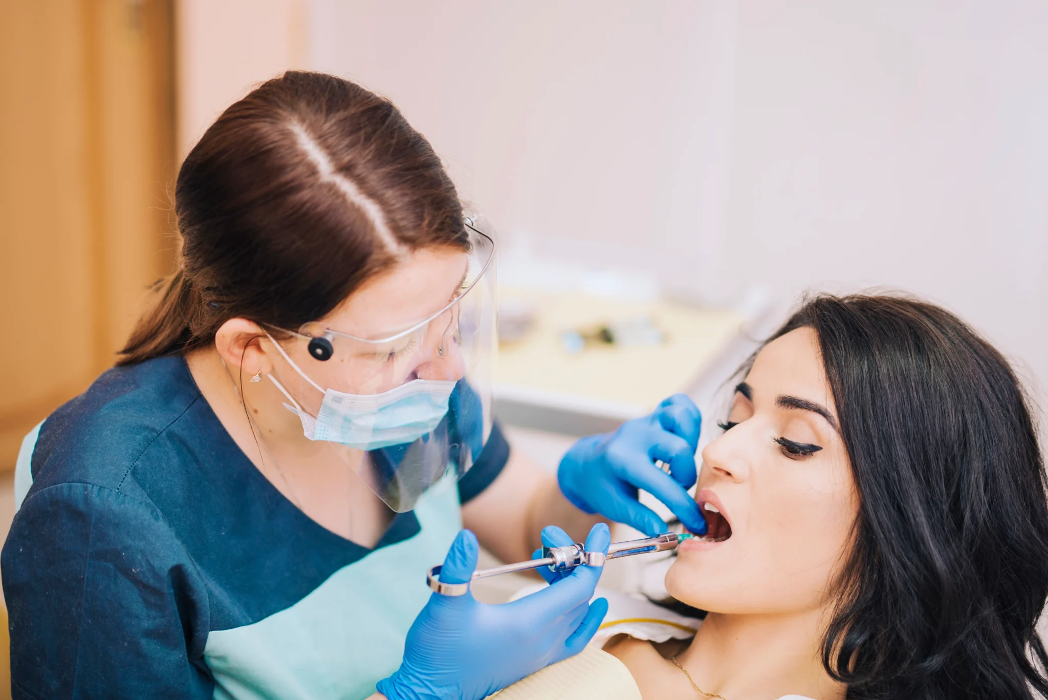 dentist making anesthetic injection patient